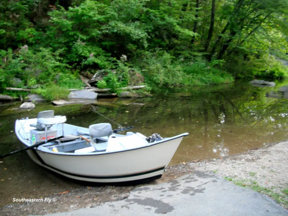 Boat on Lake Hiwassee with mountain water views